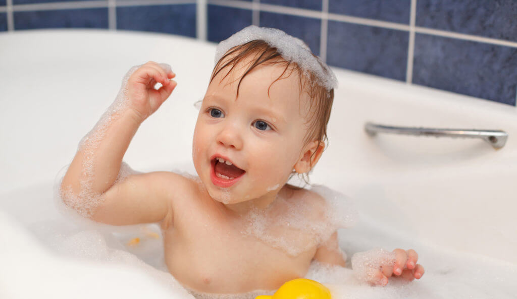 Baby in bathtub. Even baby products may contain triclosan!