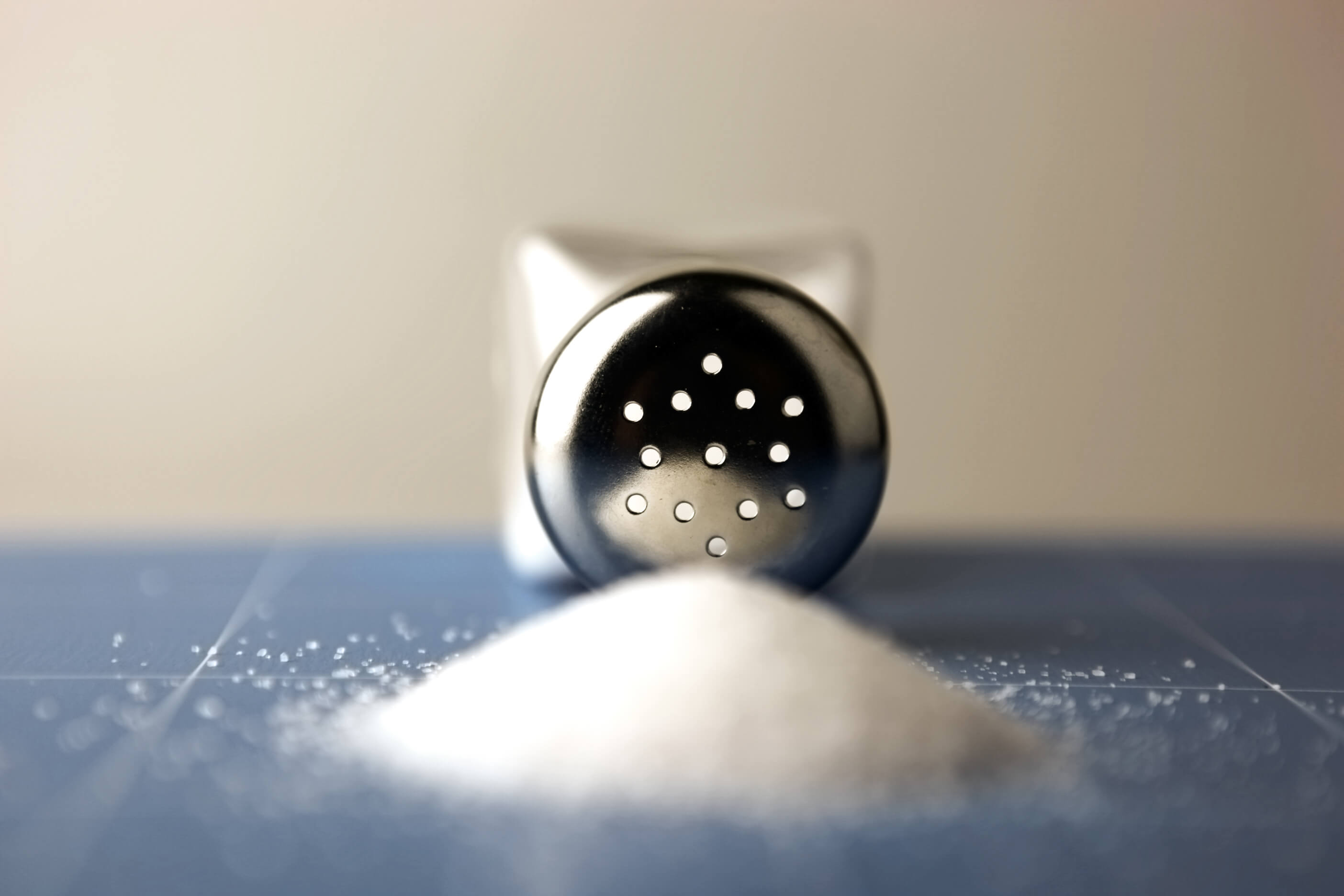 Salt shaker on wooden table