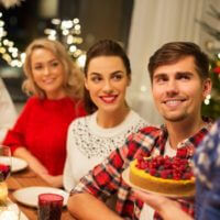 Family at the table about to eat holiday food