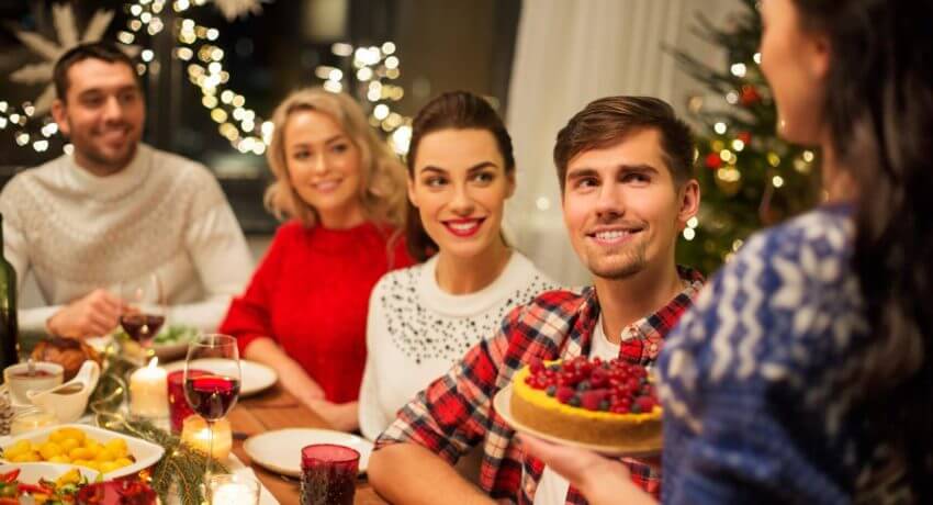 Family at the table about to eat holiday food