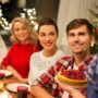 Family at the table about to eat holiday food